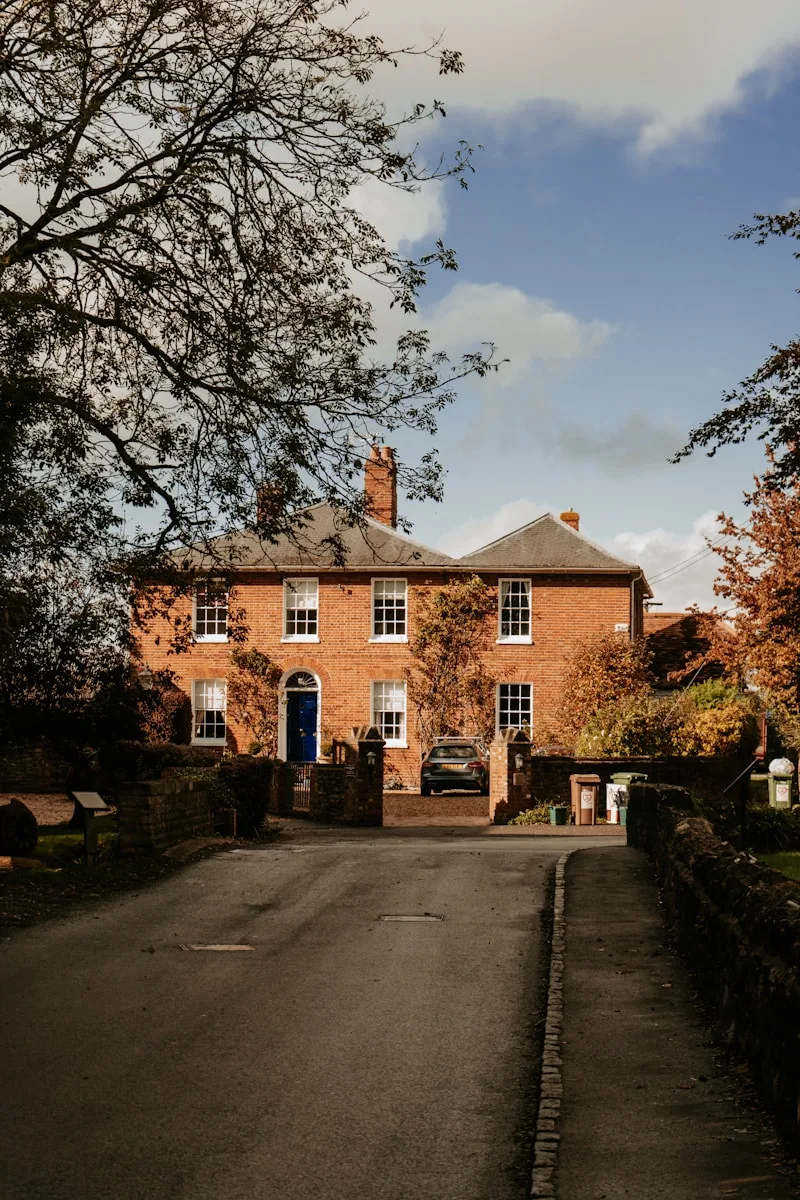 a large brick building with a blue door